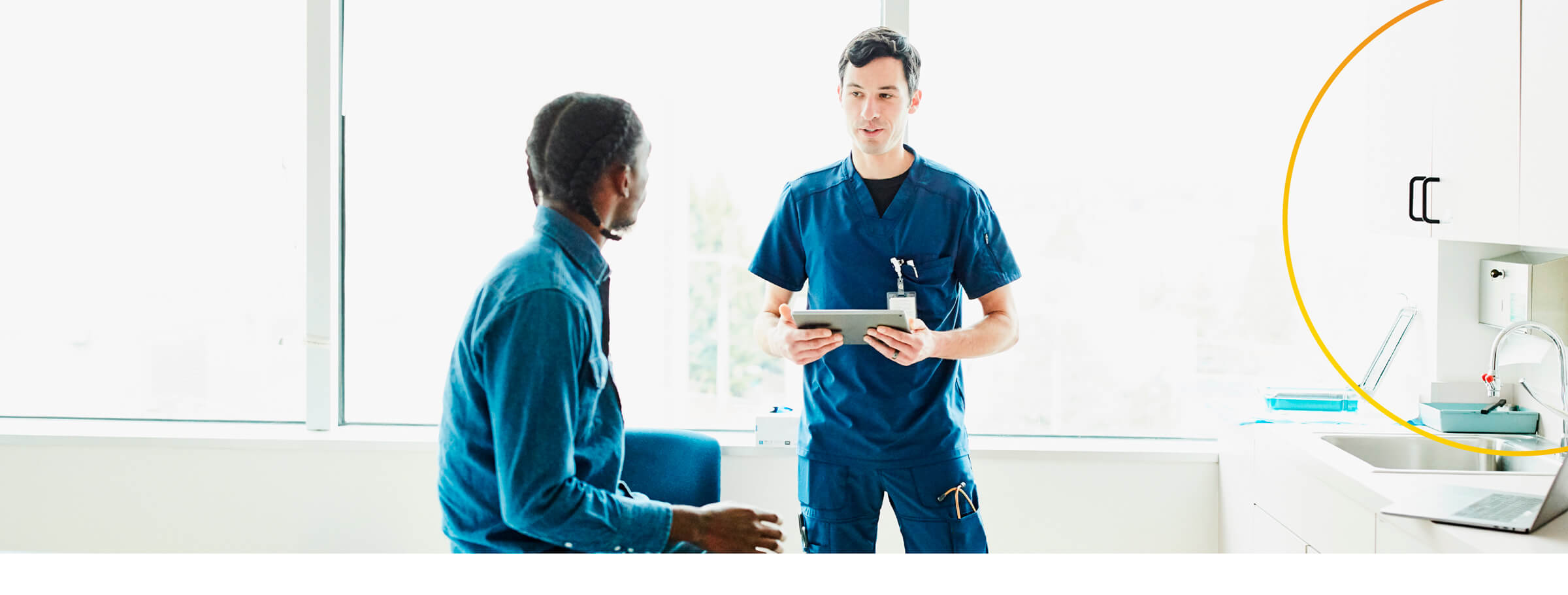 Healthcare professional giving information to patient